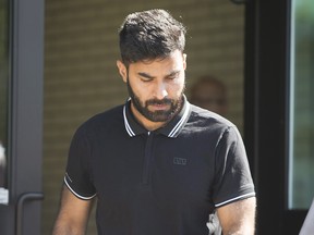 Truck driver Jaskirat Sidhu walks out of provincial court after appearing for charges due to the Humboldt Broncos bus crash in Melfort, Sask., on Tuesday, July 10, 2018. THE CANADIAN PRESS/Kayle Neis