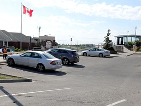 A section of the Crowfoot CTrain Station parking lot is taped off after the city and fire department discovered a depression in the pavement.