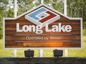A sign at Nexen Energy's Long Lake facility near Fort McMurray, Alta., Wednesday, July 22, 2015.A major Calgary energy company has pleaded guilty to federal and provincial environmental charges over one of the largest pipeline spills in Alberta history. THE CANADIAN PRESS/Jeff McIntosh ORG XMIT: CPT130