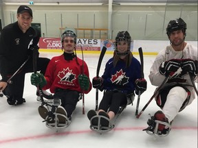 Ryan Straschnitzki, centre left, along with Chris Cederstrand, far right, pose for a photo on Friday, July 20, 2018.