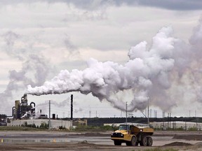 A dump truck works near the Syncrude oil sands extraction facility