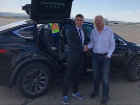 InOrbis founder and University of Calgary grad Rosario Fortugno meets billionaire Richard Branson during a recent trip to Calgary with one of his Tesla cars. He's expanding his inter-city service to become a ride sharing service in Calgary. Supplied photo