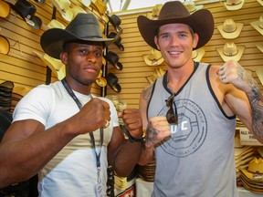 UFC fighters Hakeem Dawodu and Jordan Mein pose for a photo at Lammle's Western Wear on the Stampede grounds, the two were getting outfitted with western duds during their Calgary Stampede visit on Monday, July 9, 2018. Al Charest/Postmedia