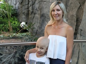 Seven-year-old Cole Mechor and his mom Lisa take in the Panda Passage exhibit at the Calgary Zoo on Monday July 23, 2018. The pair were part of a group of 65 children from Kids Cancer Care who were treated to a private visit with the pandas donated by the Calgary Chinese Cultural Centre. Gavin Young/Postmedia