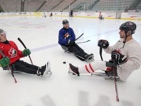 Humboldt Broncos crash survivor Ryan Straschnitzki, left, former Flames player Brian McGrattan and Chris Cederstrand at Winsport in Calgary, on Tuesday August 7, 2018.