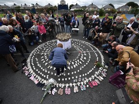 A vigil takes place at the site of the mass grave which contained the remains of 796 named babies from the Bon Secours Mother and Baby home on August 26, 2018 in Tuam, Ireland.