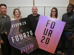 Jeff Mooij, president of 420 Premium Market poses for a photo with staff members at the company's head office in downtown Calgary. 420 Premium has been approved to open retail cannabis shops in Alberta and will begin hiring staff at a weekend Job Fair. Thursday, August 2, 2018. Dean Pilling/Postmedia