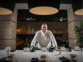 Off The Menu - Executive Chef Cole Glendinning poses for a photo at the Flower and Wolf at Sheraton Suites Calgary Eau Claire on Thursday, August 23, 2018. Al Charest/Postmedia