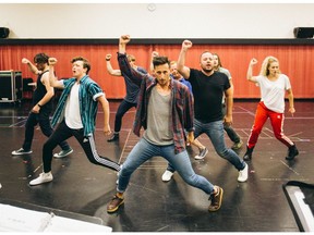 Some of the cast of the new musical Jukebox Hero at rehearsals in Calgary, including Tyler Pearse (third from left), Lawrence Libor (centre), Micheal De Rose (third from right) and Jennifer Mote (second from right).