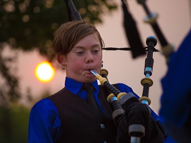 Piper Campbell Britton wth the Ogden Legion Pipe Band entertains the crowds as the sun set before the opening night of the 2018 Globalfest Fireworks Festival. The night celebrated Ukraine and lit up the sky above Elliston Park on Thursday August 16, 2018.