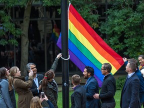 Government MLAs and guests celebrate Pride Week with the raising of a Pride flag outside the McDougall Centre in Calgary on Monday, August 27, 2018.
