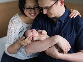 Calgary MP Tom Kmiec and his wife Evangeline hold their newborn daughter Lucy-Rose in an undated handout photo.
