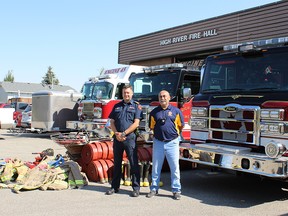 Through joint efforts with the Taber Lion’s Club, the High River Fire Department is donating approximately five tonnes of fire equipment for volunteer firefighters down in Chile. Capt. Lance Bushie, Fire Chief for the Town of High River (left) and Ricardo Berner, a member of the Taber Lion’s Club and volunteer firefighter in Santiago, are pictured at the High River Fire Hall. Supplied