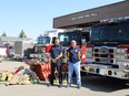 Through joint efforts with the Taber Lion’s Club, the High River Fire Department is donating approximately five tonnes of fire equipment for volunteer firefighters down in Chile. Capt. Lance Bushie, Fire Chief for the Town of High River (left) and Ricardo Berner, a member of the Taber Lion’s Club and volunteer firefighter in Santiago, are pictured at the High River Fire Hall. Supplied