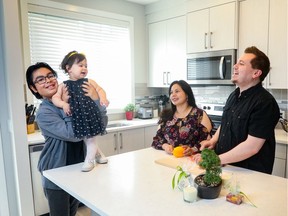 The spaciousness of their new kitchen allows Santiago Olivares-Escorcia, 11, and his sister Hadassah Viloria-Escorcia, 1, to hang out with their parents Massiel Escorcia-Caballero and Cesar Vitoria-Petit.