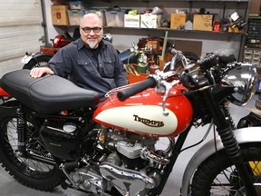Columnist Greg Williams poses in his workshop in Calgary on Wednesday, August 1, 2018 with his restored 1958 Triumph Trophy motorcycle. The project took about two years with the help of friends.