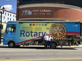 Dan and Marlene Doherty with Rotary motor home wrapped by West Canadian.