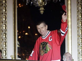 Chicago Blackhawks legend Stan Mikita is introduced on opening night on opening night of the fourth annual Blackhawks Convention in Chicago on Friday, July 15, 2011. Mikita has died at age 78. THE CANADIAN PRESS/AP/The Arlington Heights Daily Herald, Brian Hill) MANDATORY CREDIT ORG XMIT: CPT129