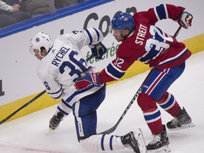 Montreal Canadiens' Mark Streit, right, pushes Toronto Maple Leafs' Kerby Rychel during second period NHL pre-season action Wednesday, September 27, 2017 in Quebec City. THE CANADIAN PRESS/Jacques Boissinot ORG XMIT: JQB109