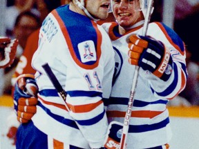 Sept. 27, 1989. Edmonton Oilers captain Mark Messier and 19-year-old Martin Gelinas celebrate a goal during a pre-season game at Northlands Coliseum on Sept. 27, 1989. Gelinas, wjho became part of the "Kid-line", made the team and at the end of the season he and the rest of the Oilers won the Stanley Cup. After beating the Boston Bruins in five games. Edmonton Sun/Postmedia Network