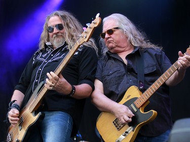 Doug Phelps, bassist/vocalist and Richard Young, guitarist with the Kentucky Headhunters, performs during day three of the 3rd annual Country Thunder music festival held at Prairie Winds Park in northeast Calgary Sunday, August 19, 2018. Dean Pilling/Postmedia