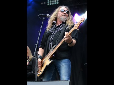Doug Phelps, bassist and vocalist with the Kentucky Headhunters, performs during day three of the 3rd annual Country Thunder music festival held at Prairie Winds Park in northeast Calgary Sunday, August 19, 2018. Dean Pilling/Postmedia