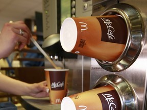 An employee prepares a latte at a McDonald's Corp. McCafe.