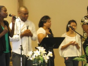 Bolante Alo singing in the choir at Evangel Assembly Christian Church.
