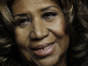 FILE - In this Feb. 11, 2011 file photo, Aretha Franklin smiles after the Detroit Pistons-Miami Heat NBA basketball game in Auburn Hills, Mich. Franklin is seriously ill, according to a person close to the singer. The person, who spoke on the condition of anonymity because the person was not allowed to publicly talk about the topic, told The Associated Press on Monday, Aug. 13, 2018, that Franklin is seriously ill. No more details were provided. (AP Photo/Paul Sancya, File)