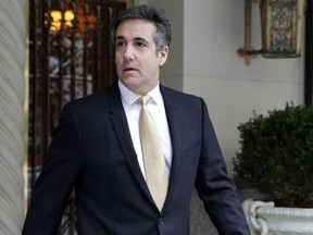 Michael Cohen, former personal lawyer to President Donald Trump, leaves his apartment building, in New York, Tuesday, Aug. 21, 2018. Cohen could be charged before the end of the month with bank fraud in his dealings with the taxi industry and with committing other financial crimes, multiple people familiar with the federal probe said Monday.
