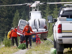 RCMP, Alpine Rescue and various emergency crews deal with a twin engine plane crash at Rae Glacier Trail in K-Country which killed the two male occupants. The plane came from Calgary on Wednesday August 1, 2018. Darren Makowichuk/Postmedia