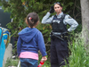 An RCMP officer meets asylum seekers at the border crossing near Perry Mills, New York, June 2018.