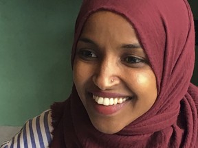 In this Aug. 16, 2018 photo, Democrat Ilhan Omar, the nation's first Somali-American legislator who won her party's congressional primary in the race, talks during an interview at Peace Coffee in Minneapolis. Just two years ago, the Minnesota Democrat became the first Somali-American elected to a state legislature. Now she's likely to become one of the first two Muslim women elected to Congress.