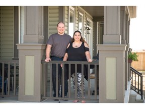 Sasha and Mark Kirkland on the veranda of their new home in Southwinds by Mattamy Homes.