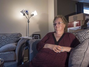 Substitute teacher Charlene Klyne, a La Loche school shooting survivor, sits at her home in Saskatoon, Monday, December 5, 2016. Saskatchewan's ombudsman says a teacher who was shot in the face in the 2016 La Loche school shootings is not entitled to compensation payments for pain and suffering. Charlene Klyne, a substitute teacher, lost all vision in her left eye and can only see dark shadows in her right eye.