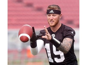 Calgary Stampeders, Bo Levi Mitchell and team deal with thick smoke and heat during practice at McMahon stadium in Calgary on Thursday August 16, 2018. Darren Makowichuk/Postmedia