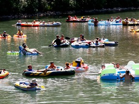 Calgarians take to the Elbow River too cool down during the current heat wave.