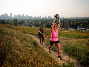 Personal trainer Leslie Roland, left helps Jackie Pearson stay fit in Calgary,  on Wednesday August 1, 2018. Leah Hennel/Postmedia