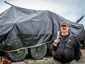 Brian McGregor, a volunteer with Calgary Leopard Tank Historical Squadron, works on the Military Museum's newest addition, a light armoured vehicle called the LAV III. It will become part of a new museum on the conflict in Afghanistan.