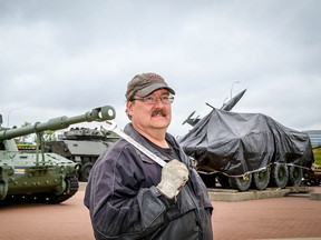 Brian McGregor, a volunteer with Calgary Leopard Tank Historical Squadron, works on the Military Museum's newest addition, a light armoured vehicle called the LAV III, nicknamed ëthe green monsterí by Taliban forces, the LAV III will be unveiled to the public September 10. . Al Charest/Postmedia