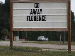 A sign reads "Go Away Florence" ahead of the arrival of Hurricane Florence on September 12, 2018 in Myrtle Beach, South Carolina.