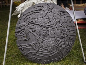 Calgary's newly unveiled storm water manhole cover, designed by Andrea Williamson. Three new manhole cover designs were revealed on Saturday, Sept. 15, 2018 at Prince's Island Park. Kerianne Sproule/Postmedia Calgary