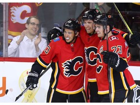 Matthew Tkachuk, centre Johnny Gaudreau and Sean Monahan will fly Flames colours in China this preseason. Postmedia file photo.