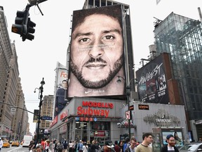 A Nike ad featuring American football quarterback Colin Kaepernick is on display in New York City. The campaign has reignited the debate about protests and flags.