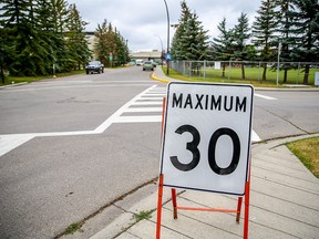 Council will debate a notice of motion seeking to lower the speed limit on neighbourhood streets to 30 km/h. Al Charest/Postmedia
