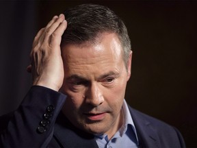 Jason Kenney adjusts his hair as he speaks to the media at his first convention as leader of the United Conservative Party in Red Deer, Alta., Sunday, May 6, 2018. The Alberta government says it will be doing follow-up "damage control" on opposition Leader Jason Kenney's visit to India. THE CANADIAN PRESS/Jeff McIntosh ORG XMIT: CPT126