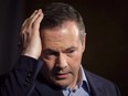 Jason Kenney adjusts his hair as he speaks to the media at his first convention as leader of the United Conservative Party in Red Deer, Alta., Sunday, May 6, 2018. The Alberta government says it will be doing follow-up "damage control" on opposition Leader Jason Kenney's visit to India. THE CANADIAN PRESS/Jeff McIntosh ORG XMIT: CPT126