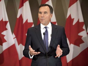 Federal Finance Minister Bill Morneau addresses journalists in Toronto on Thursday August 30, 2018. Finance Minister Bill Morneau is focused more on targeted measures to enhance Canada's competitiveness rather than broad-based corporate tax cuts, sources say.