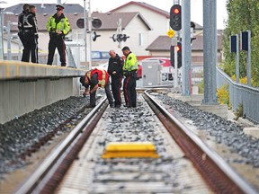 Police investigate the scene where a pedestrian was hit by a CTrain at the Saddletowne Station in northeast Calgary on Tuesday September 11, 2018. 
Gavin Young/Postmedia