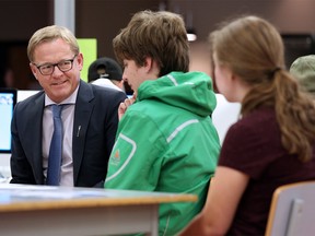 Alberta Education Minister David Eggen talks with Dr. E.P. Scarlett students taking part in the Calgary Board of Education's Worktopia program on Wednesday September 12, 2018. The unique program helps autistic high school kids prepare for graduation by giving them a chance to learn workplace skills. Gavin Young/Postmedia